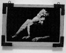 Nude male on wood